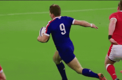 Man In Blue Jersey Number 9 Running With Rugby Ball GIF