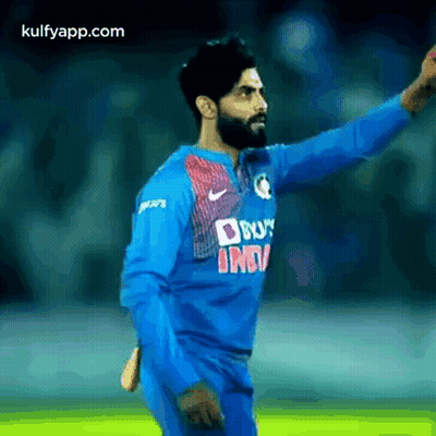 Man In Blue Jersey With Hand Outstretched GIF