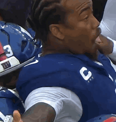 Man In Blue Jersey With Letter C Sitting In Stadium GIF