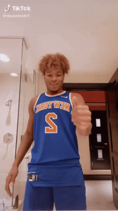 Man In Blue Jersey With Letter S Thumbs Up GIF