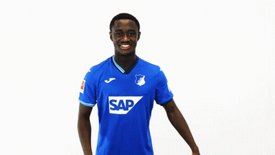 Man In Blue Jersey With Letter T Smiling GIF