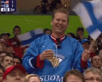 Man In Blue Jersey With Suon Holding Flag GIF