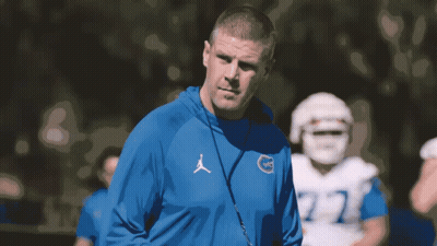 Man In Blue Jordan Sweatshirt In Front Of Football Player GIF