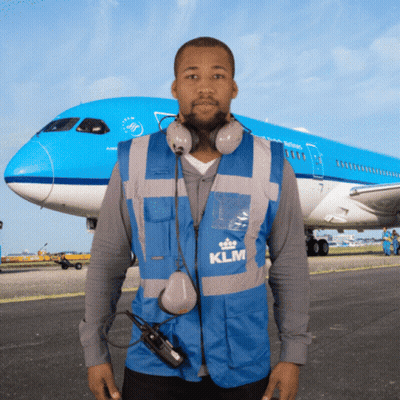 Man In Blue KLM Vest In Front Of Plane GIF