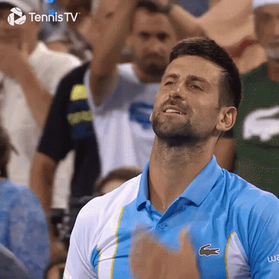 Man In Blue Lacoste Shirt Applauding Before Crowd GIF