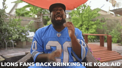 Man In Blue Lions Jersey Sitting In Chair GIF