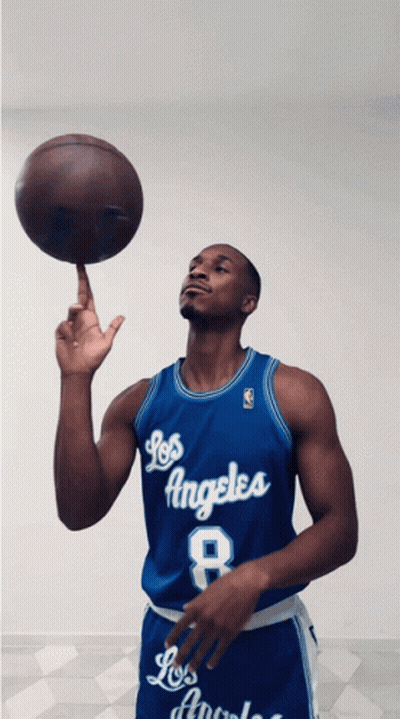 Man In Blue Los Angeles Jersey Holding Basketball GIF