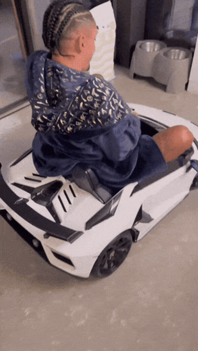 Man In Blue Louis Vuitton Jacket In Toy Car GIF