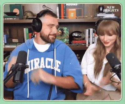 Man In Blue Miracle Sweatshirt At Microphone GIF