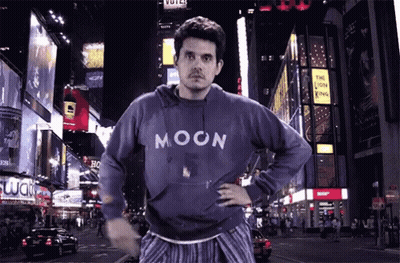 Man In Blue Moon Sweatshirt On Night Street GIF