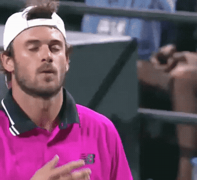 Man In Blue New Balance Shirt Waving GIF