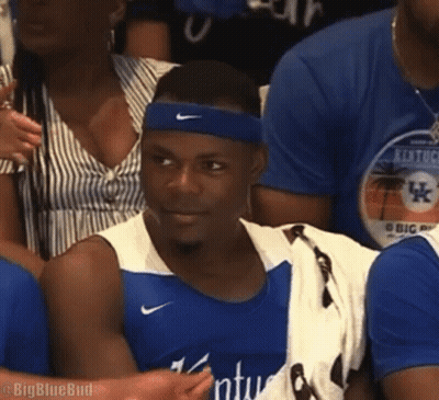 Man In Blue Nike Headband Sitting In Crowd GIF