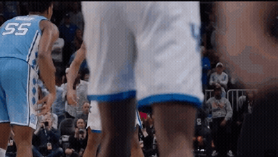 Man In Blue Nike Headband Sitting In Crowd GIF