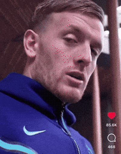 Man In Blue Nike Hoodie Looking At Camera GIF
