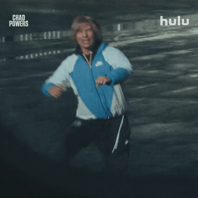 Man In Blue Nike Jacket Running In Parking Garage GIF
