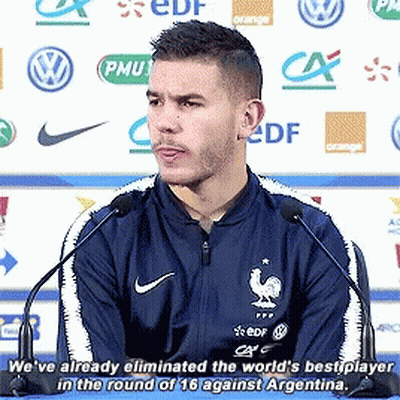 Man In Blue Nike Jacket Speaking Into Microphone GIF