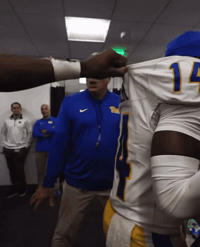 Man In Blue Nike Jacket Talking To Football Player #14 GIF