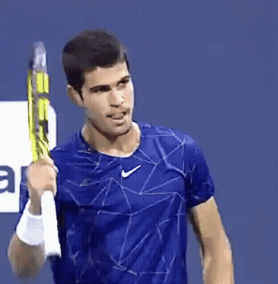Man In Blue Nike Shirt Holding Tennis Racket GIF