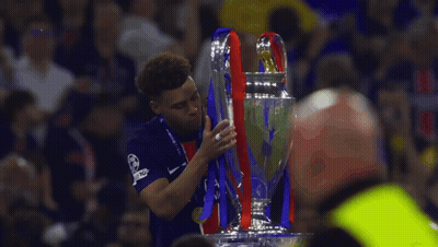 Man In Blue Nike Shirt Holding Trophy GIF
