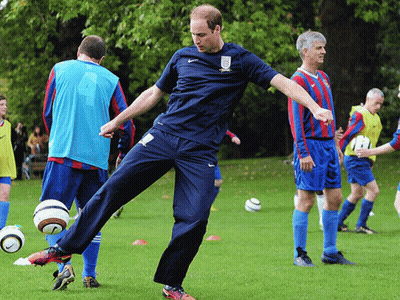 Man In Blue Nike Shirt Kicking Soccer Ball GIF