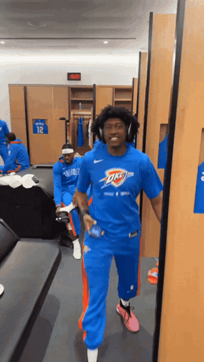 Man In Blue Oklahoma City Thunder Shirt Walking GIF