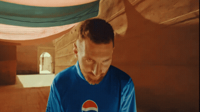 Man In Blue Pepsi Shirt Looking Down GIF