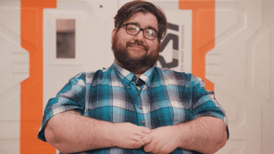 Man In Blue Plaid, Glasses At Ics Sign GIF