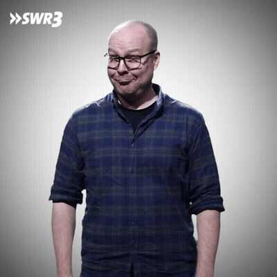 Man In Blue Plaid Shirt And Glasses By SWR3 Sign GIF