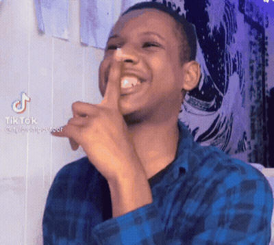Man In Blue Plaid Shirt Laughing Shushing GIF