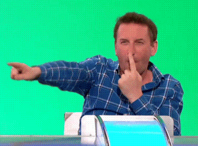 Man In Blue Plaid Shirt Making Funny Face Pointing GIF