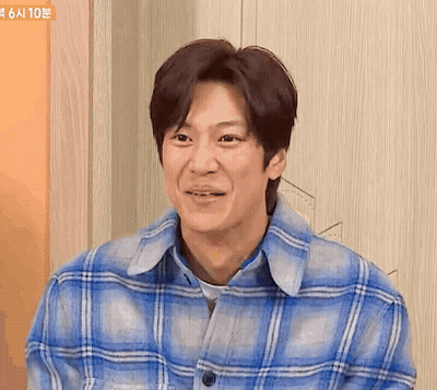 Man In Blue Plaid Shirt Smiling GIF