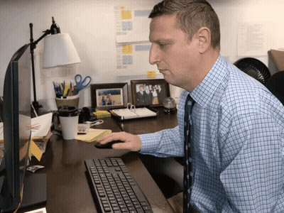 Man In Blue Plaid Shirt Using Keyboard GIF