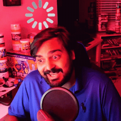 Man In Blue Polo Shirt At Microphone With Loading Screen GIF