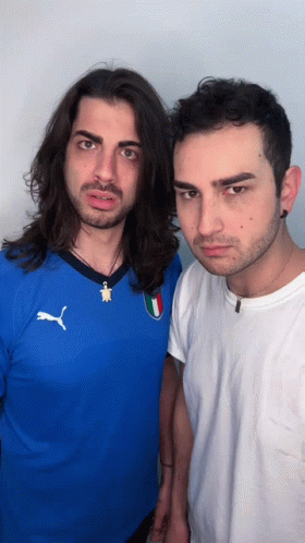 Man In Blue Puma Shirt Next To Man In White GIF