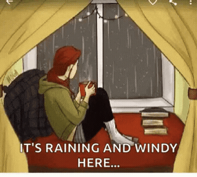 Man In Blue Raincoat Kneeling In Grass GIF