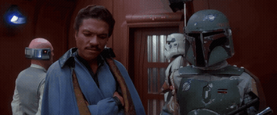 Man In Blue Robe Next To Storm Trooper GIF