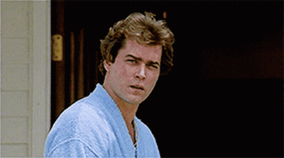 Man In Blue Robe Standing In Front Of House GIF