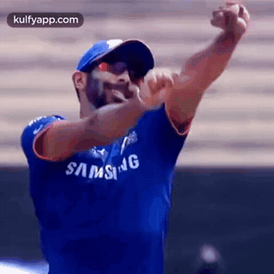 Man In Blue Samsung Shirt And Blue Hat Throwing Ball GIF