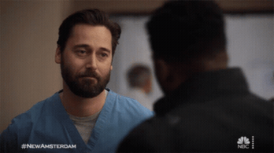 Man In Blue Scrub Talking To Another Man #NewAmsterdam GIF