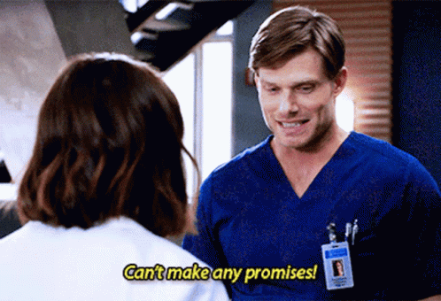 Man In Blue Scrub Talking To Woman Saying Can't Make Any Promises GIF