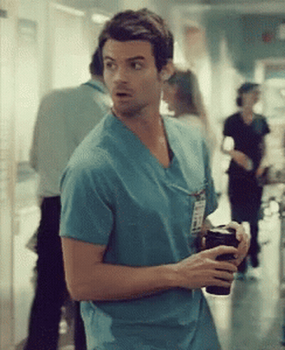 Man In Blue Scrub Top With Name Tag GIF