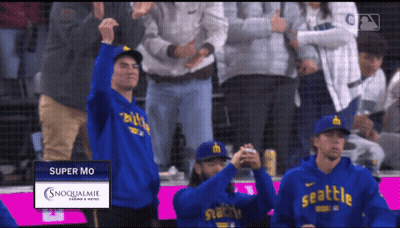 Man In Blue Seattle Hoodie In Crowd GIF