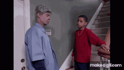 Man In Blue Shirt And Boy In Red Shirt Standing On Stairs GIF