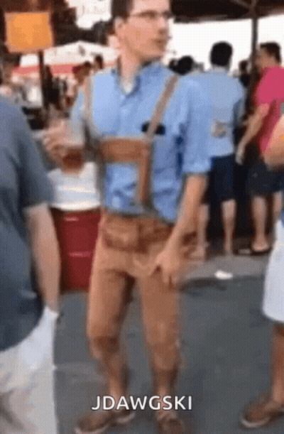 Man In Blue Shirt And Brown Pants With Jdawgski Above Him GIF