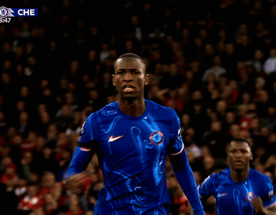 Man In Blue Shirt And Crowd With Che Logo GIF