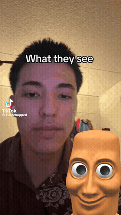 Man In Blue Shirt And Glasses Walking Down Street GIF