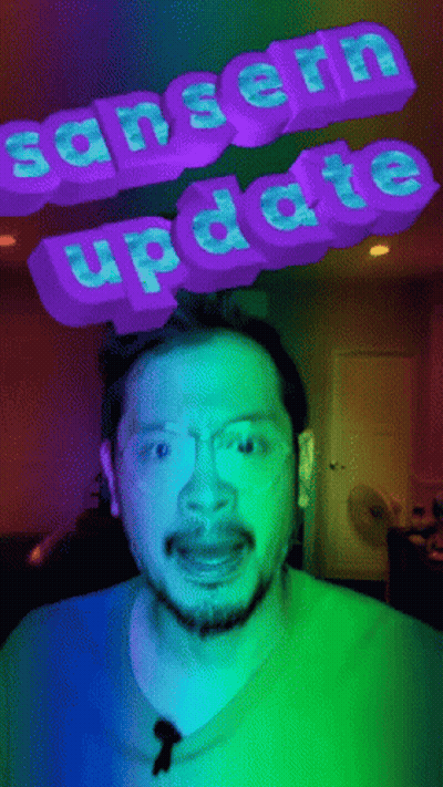 Man In Blue Shirt And Glasses With Sanserin Update Sign GIF