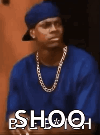 Man In Blue Shirt And Hat Saying Shooh GIF