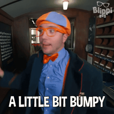 Man In Blue Shirt And Orange Bow Tie Says A Little Bit Bumpy GIF