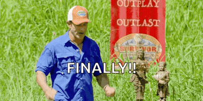 Man In Blue Shirt And Orange Hat With Red Banner Saying Outplay Outlast GIF